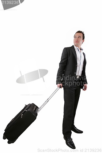 Image of Young business man walking on white background with his trolley 