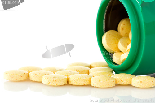 Image of  pill bottle with yellow pills