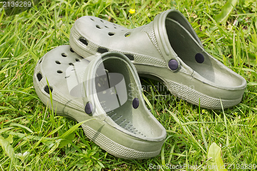 Image of rubber sandals on a grass