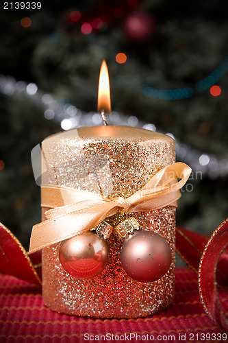 Image of burning gold festive  candle
