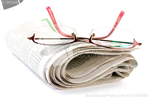 Image of newspaper with glasses 