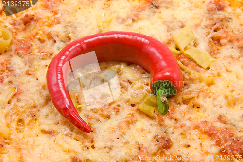 Image of pizza with red chili pepper