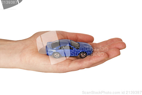 Image of  hand with blue car