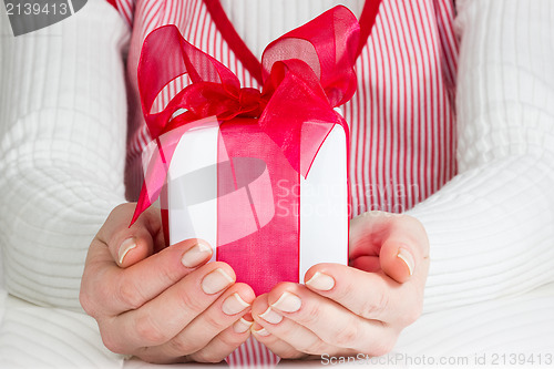 Image of Woman showing  gift