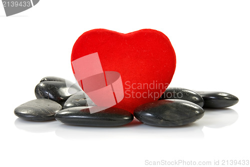 Image of red heart with black stones