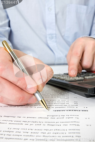 Image of businessman working with documents