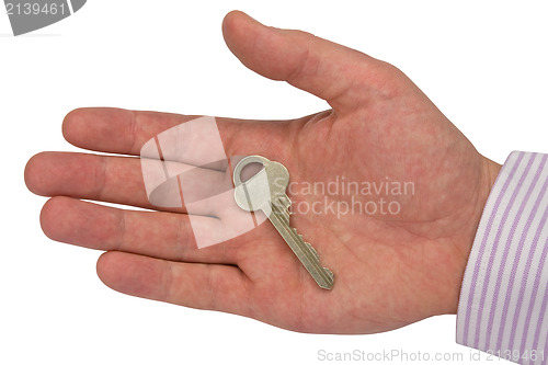 Image of metal key in hand