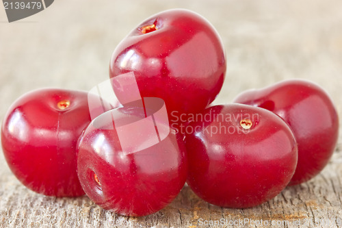 Image of cherries  on the  wood