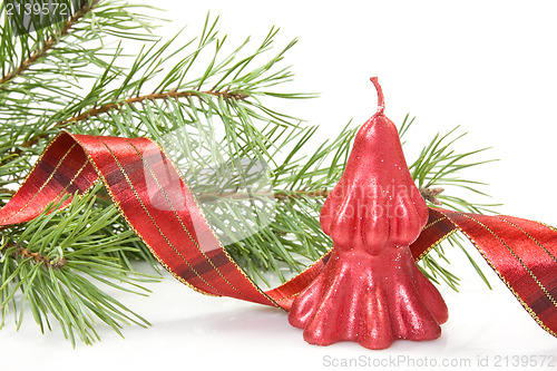 Image of red christmas candle and pine branch