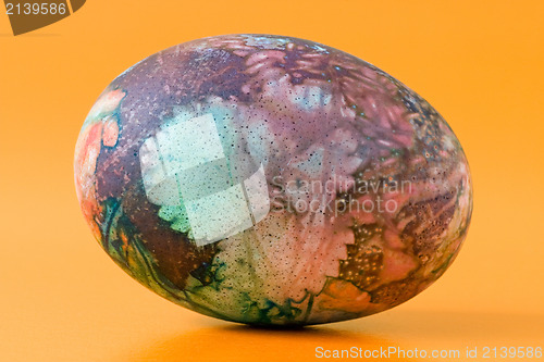 Image of ornate easter egg, isolated on orange background