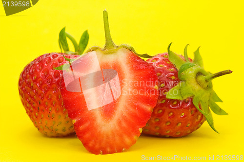 Image of strawberries on yellow background