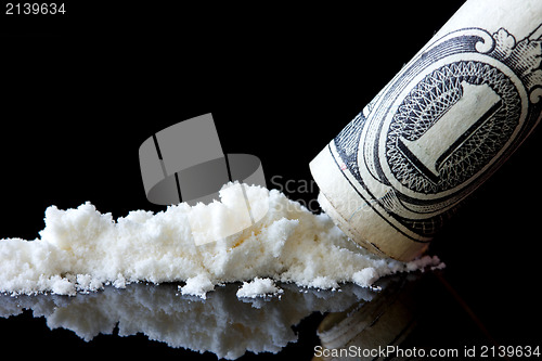 Image of Cocaine and dollar on black background