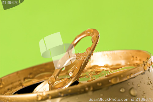 Image of opened can of cold beer