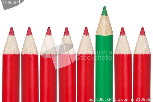 Image of Many red pencils and one green