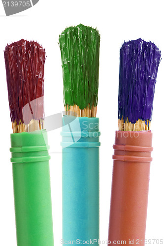 Image of three paintbrushes with color paint