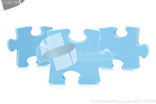 Image of three blue  puzzle pieces