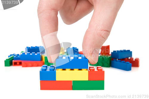 Image of Hand and toy blocks