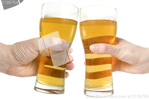 Image of two hands holding beers making a toast 