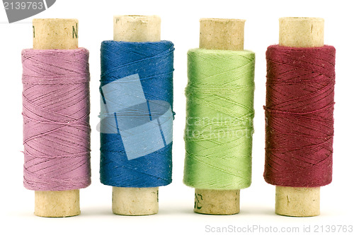 Image of four colorful thread spools