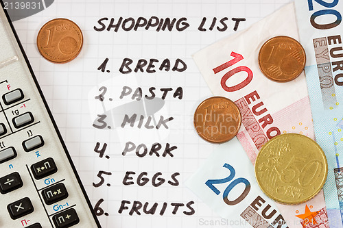 Image of shopping list with calculator and money