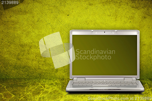 Image of computer on green and dirty background