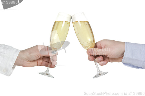 Image of Two hands with champagne glasses