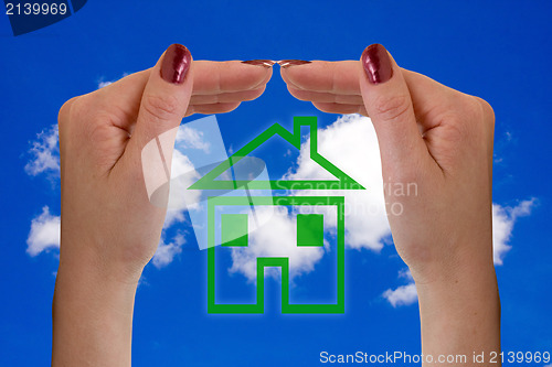Image of hands and icon house