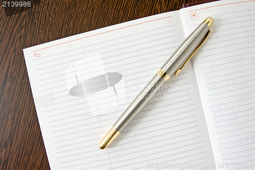 Image of  pen and notebook 