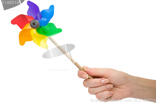 Image of hand with a color pinwheel