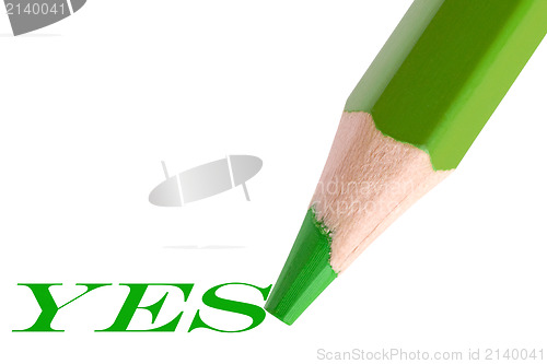 Image of green pencil writing word "yes"