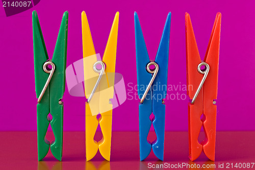 Image of four colorful clothespins