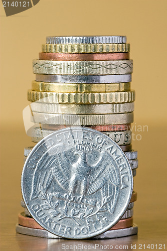 Image of coins stack with quarter dollar