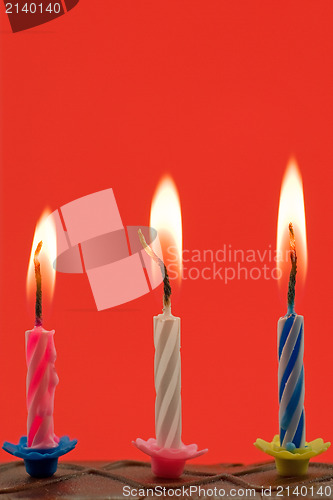 Image of birthday candles in a cake