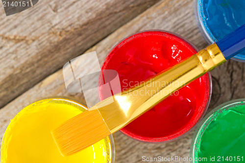 Image of  color paints on the wooden plank
