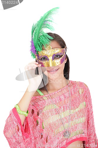 Image of Portrait of attractive beautiful teenager wearing carnival mask 