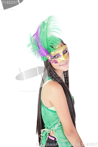 Image of pretty teenage girl in the carnival mask 