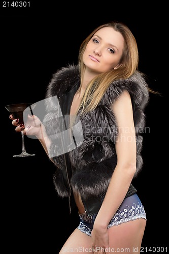 Image of blonde with a glass in hands