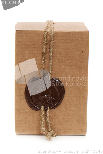 Image of cardboard box with stamp isolated on white background