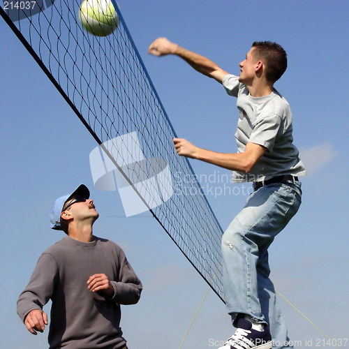 Image of Couple men playing volleyball