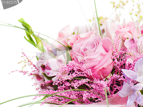 Image of fragment of colorful bouquet of roses, cloves, orchids and frees