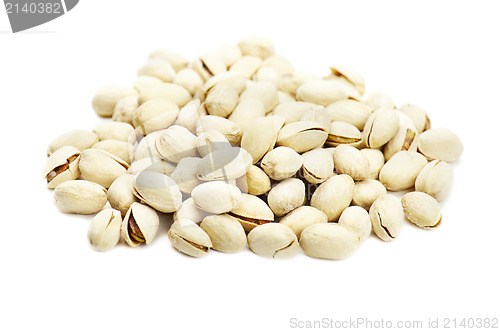 Image of dry salted pistachios on white background