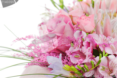 Image of fragment of colorful bouquet of roses, cloves, orchids and frees