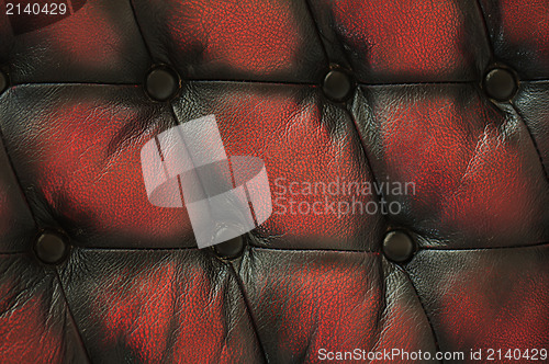 Image of Close up old red black luxury buttoned leather background