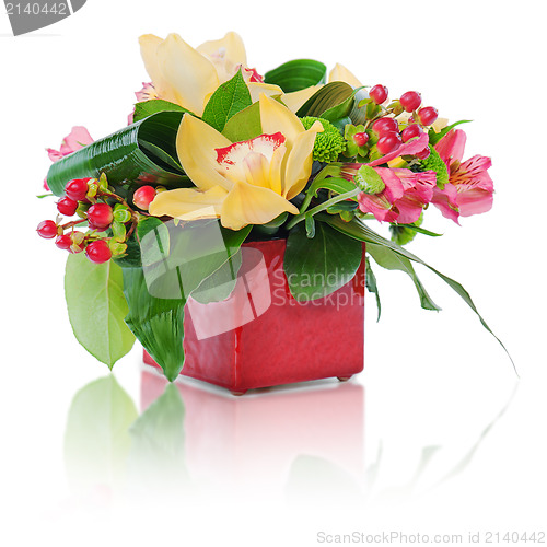 Image of colorful floral bouquet of roses, cloves and orchids arrangement