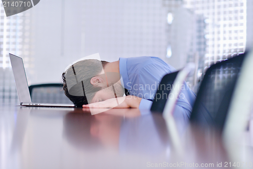 Image of business man with problems and stress in the office