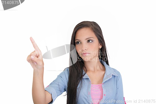 Image of Portrait of young business woman pointing at white background