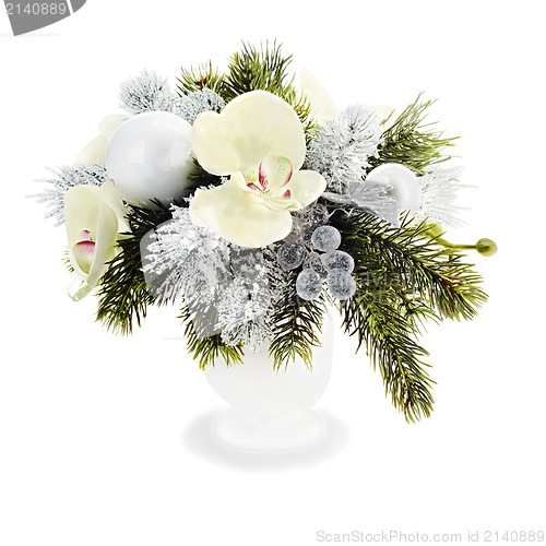 Image of Christmas arrangement of Christmas balls, orchids, snowflakes, b