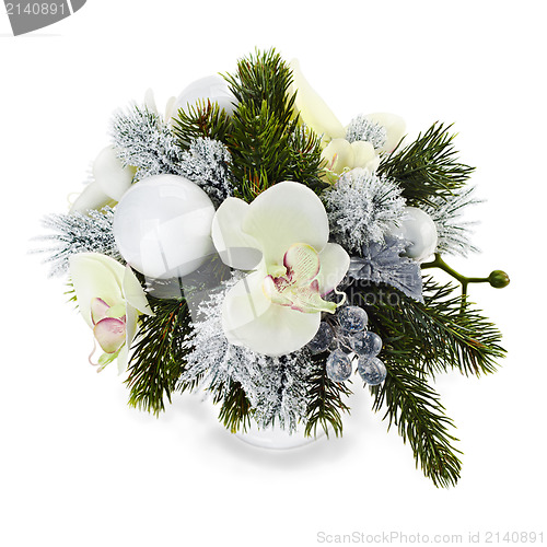 Image of Christmas arrangement of Christmas balls, orchids, snowflakes, b