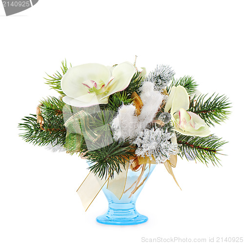 Image of Christmas arrangement of Christmas balls, orchids, snowflakes, beads and pine branches isolated on white background