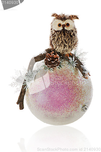Image of Christmas composition of owl, pine needles, snowflakes and white
